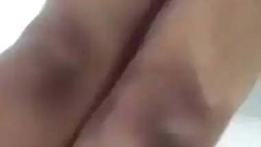 Beautiful desi girl lifting top to reveal sexy boobs